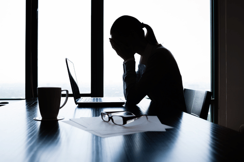 woman-facepalming-in-office